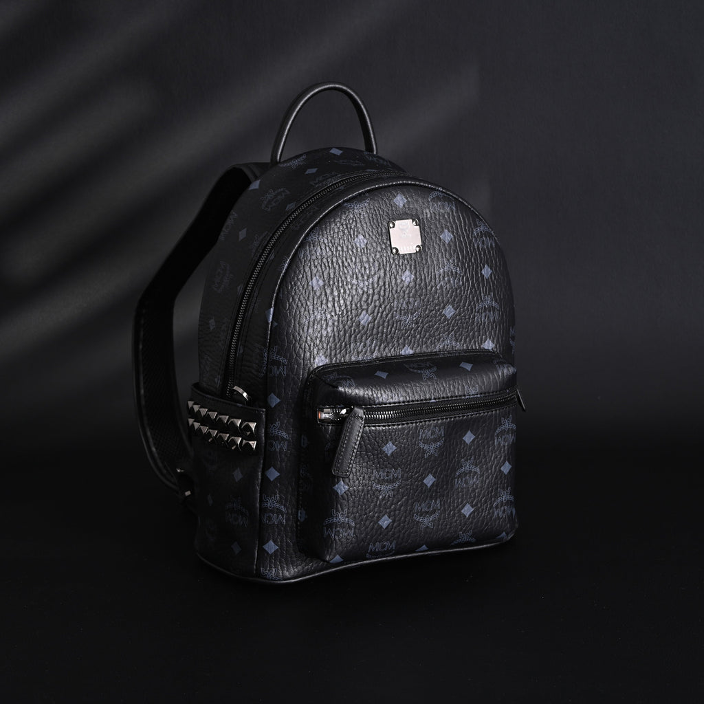 MCM Stark Visetos Medium Backpack – Black Monogram with Studded Detailing